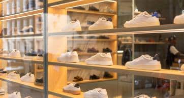 Fashionable sneakers on display in store window