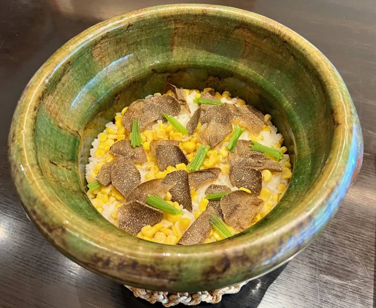 Rice cooked in earthenware pot, with corn