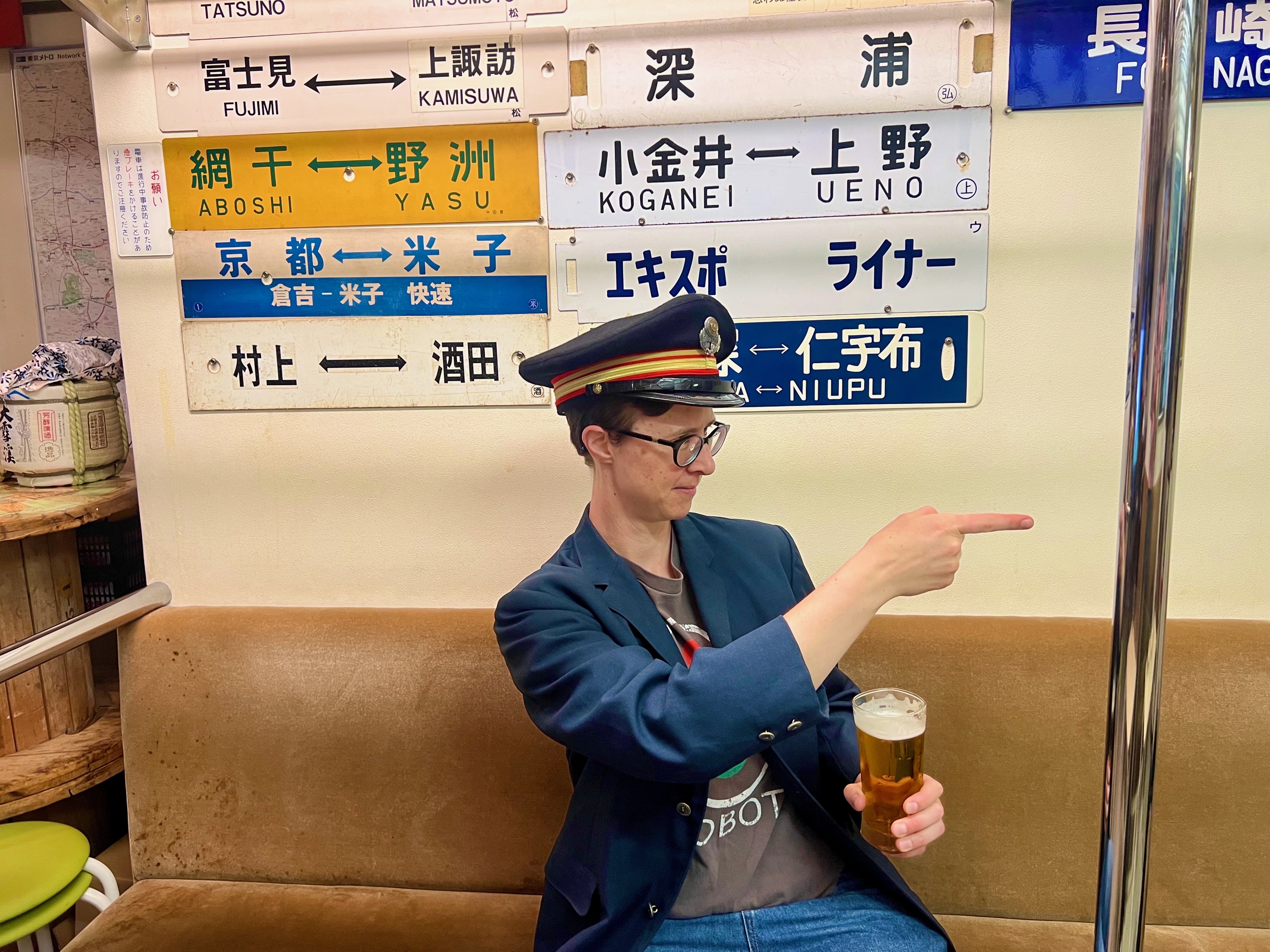 Carey as train conductor