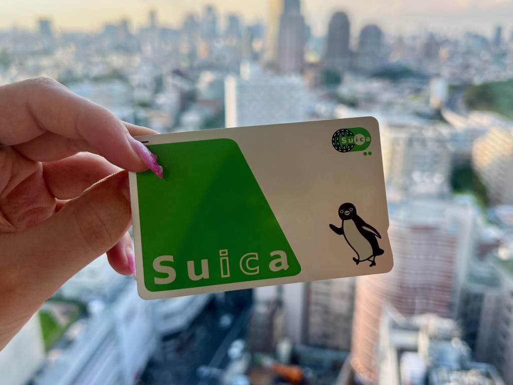 Wide shot of Suica card with city background