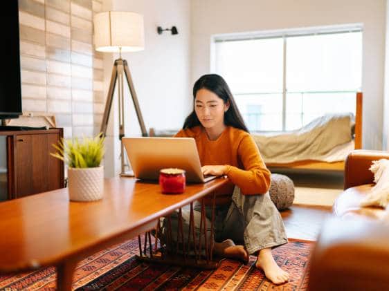 woman on laptop working from home japan